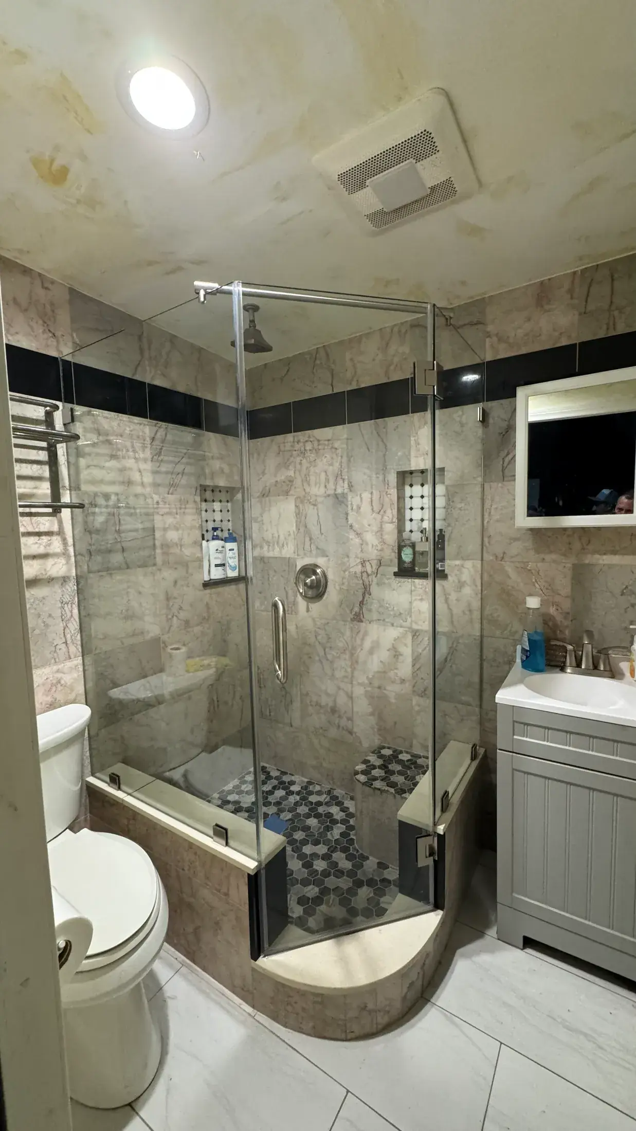 Corner shower enclosure